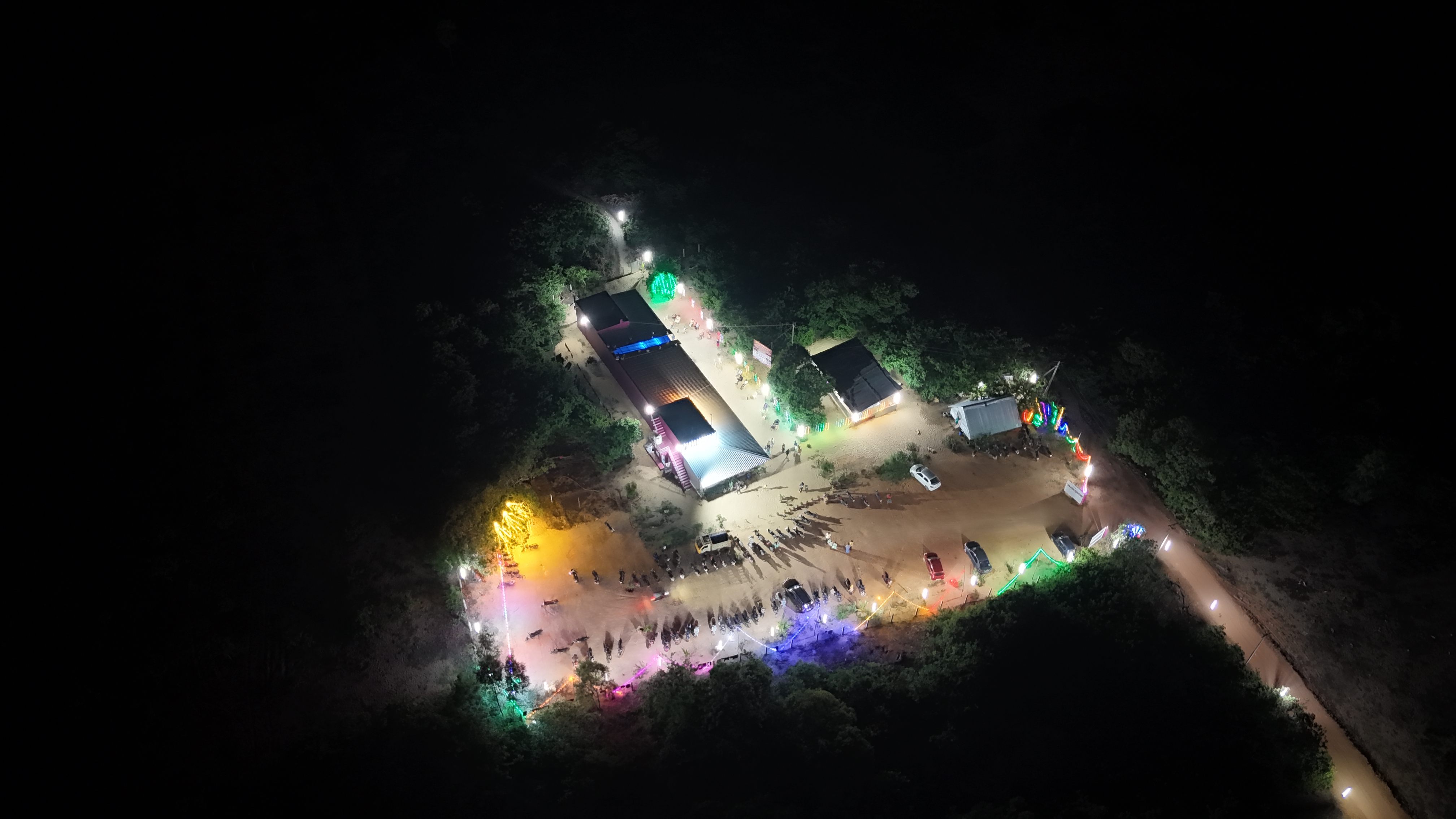 Aerial night view of Amudhan Crackers showroom in Nochikadu illuminated with festive lights